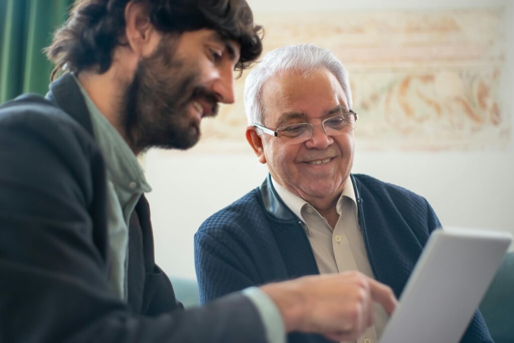 Individuals discussing paperwork with insurance broker