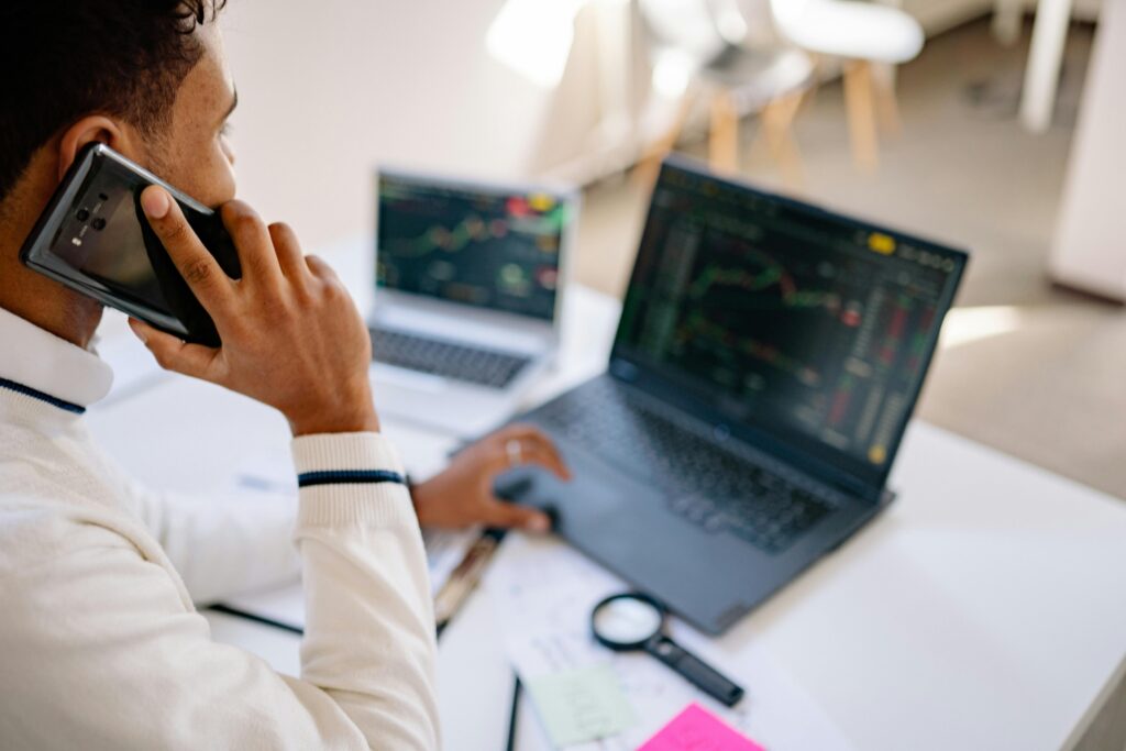 Insurance broker taking client call in office setting